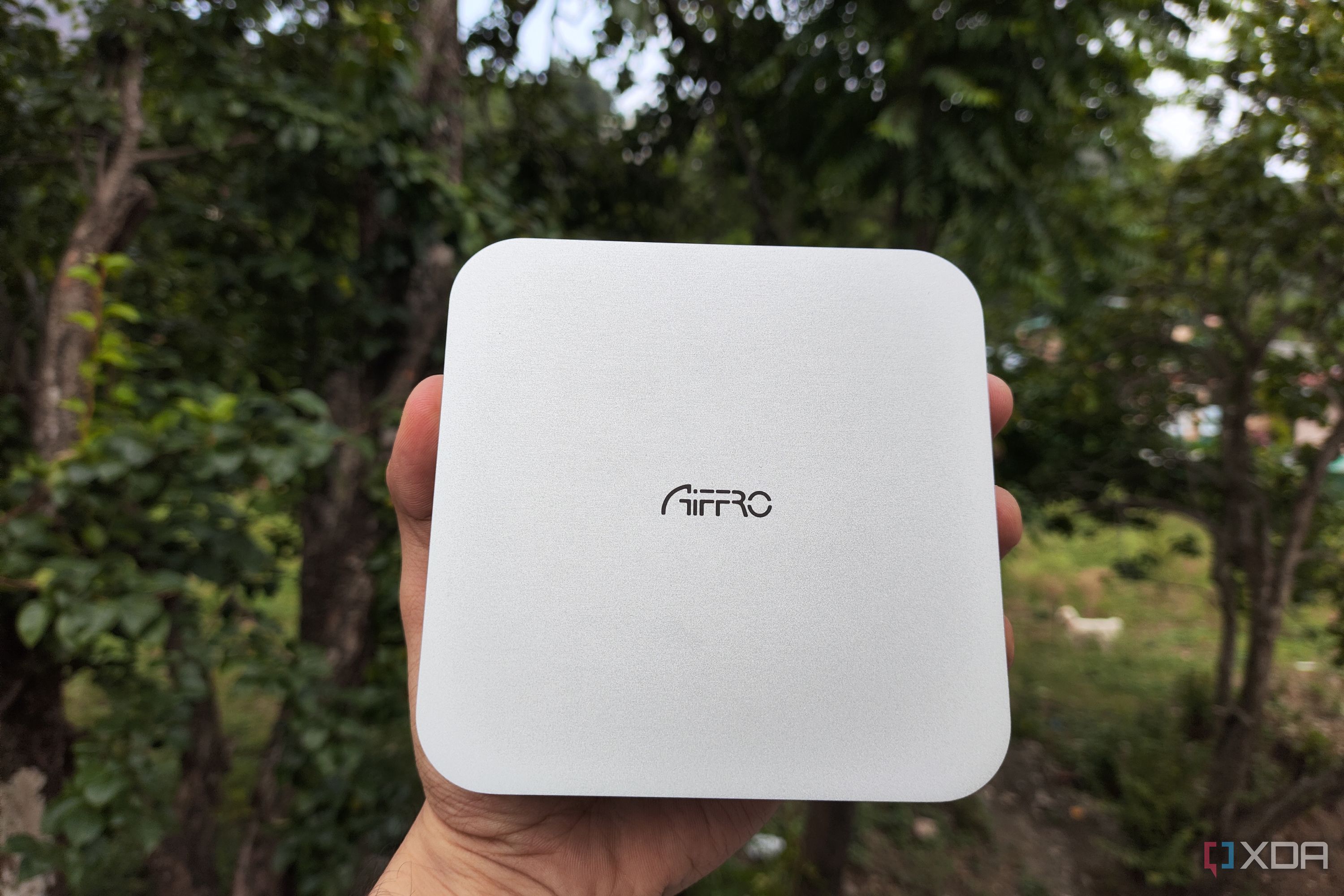 A person holding the Aiffro K100 NAS
