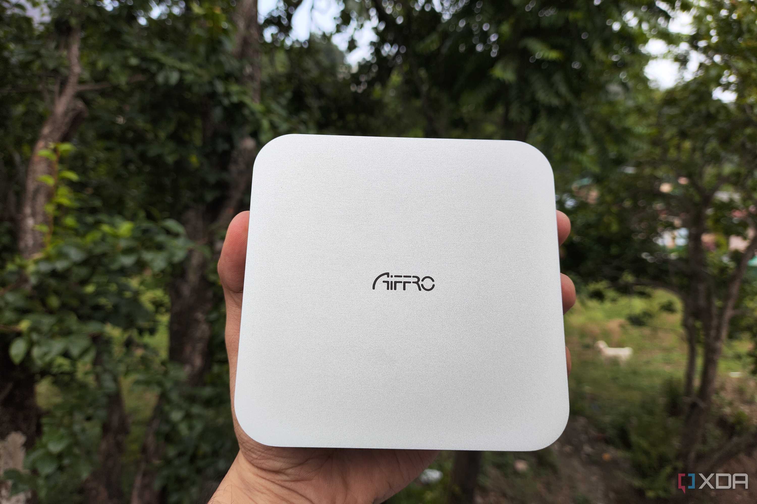 A person holding the Aiffro K100 NAS