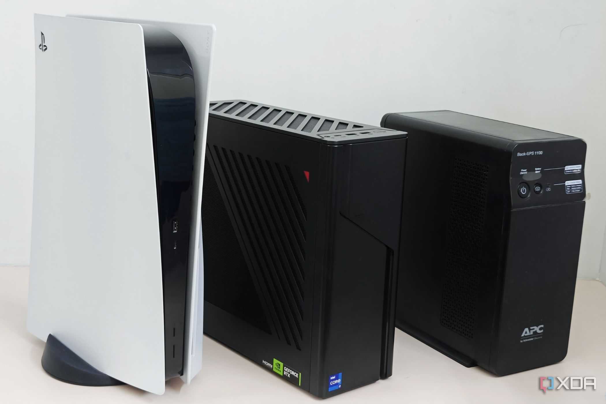 An image showing the size comparison of the G22CH with PS5 and a UPS.