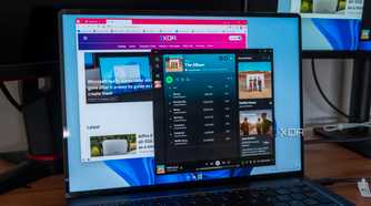 A laptop running Spotify and Vivaldi
