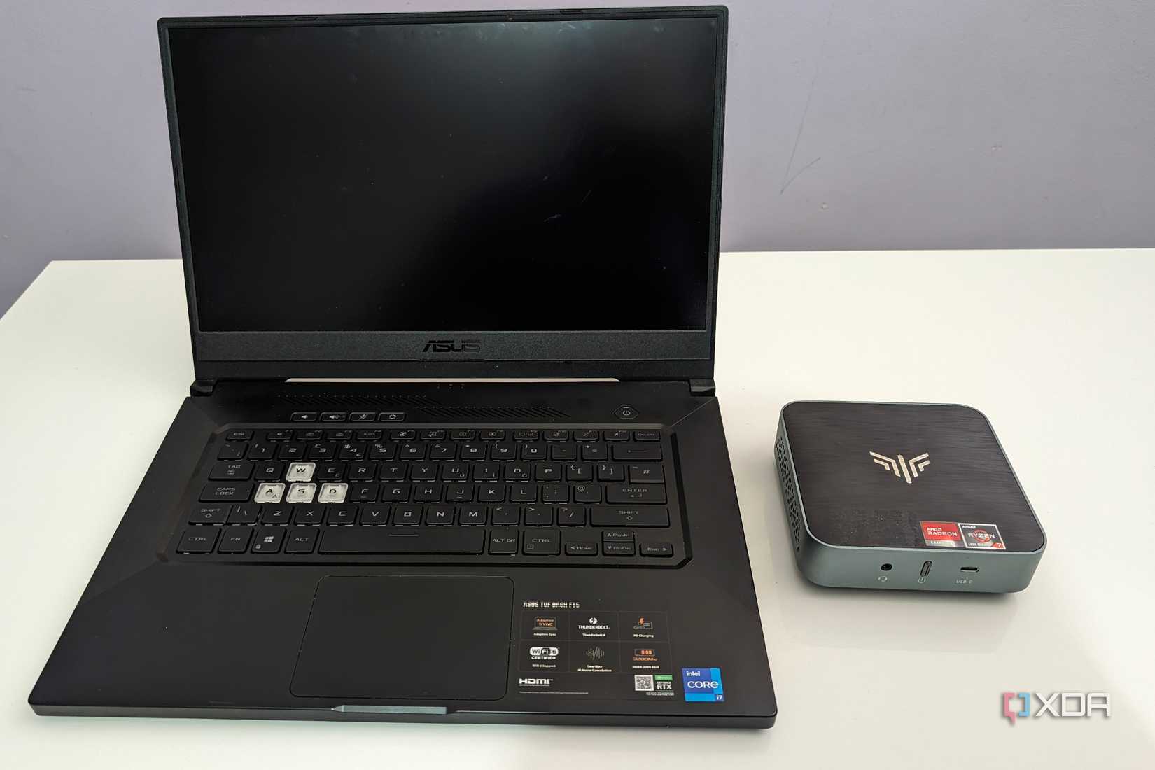 asus laptop next to an amd based mini PC