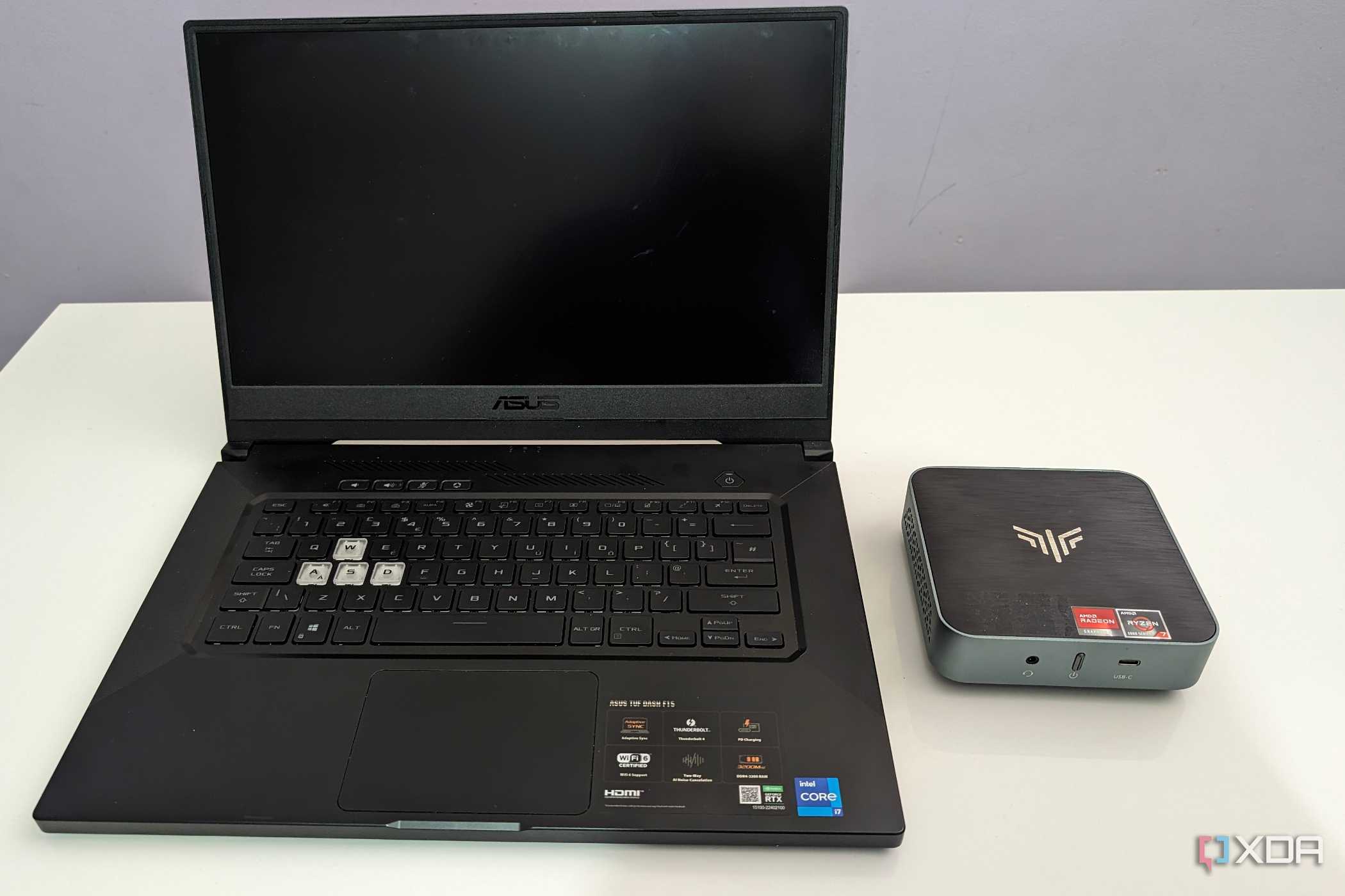 asus laptop next to an amd based mini PC