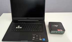 asus laptop next to an amd based mini PC