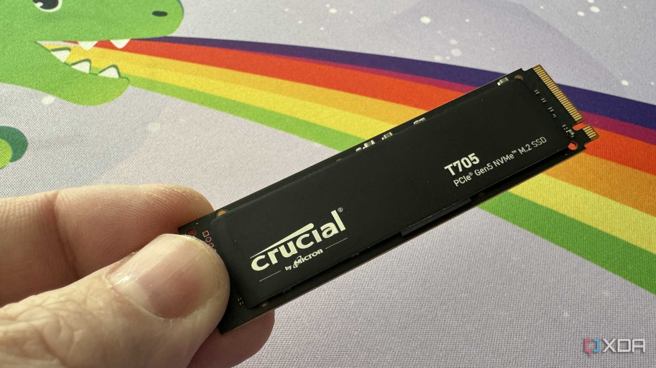 crucial t705 ssd held up in three fingers