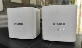 Two D-Link M15/2 Eagle Pro AI Mesh routers placed side-by-side
