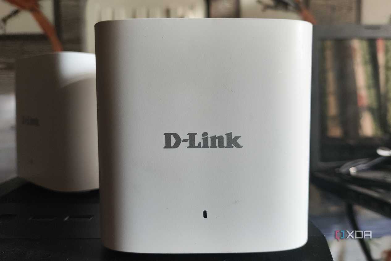Two D-Link M15/2 Eagle Pro AI Mesh routers placed side-by-side