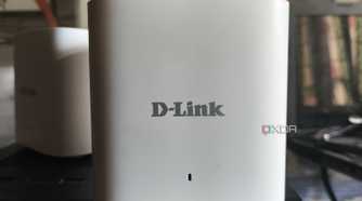 Two D-Link M15/2 Eagle Pro AI Mesh routers placed side-by-side