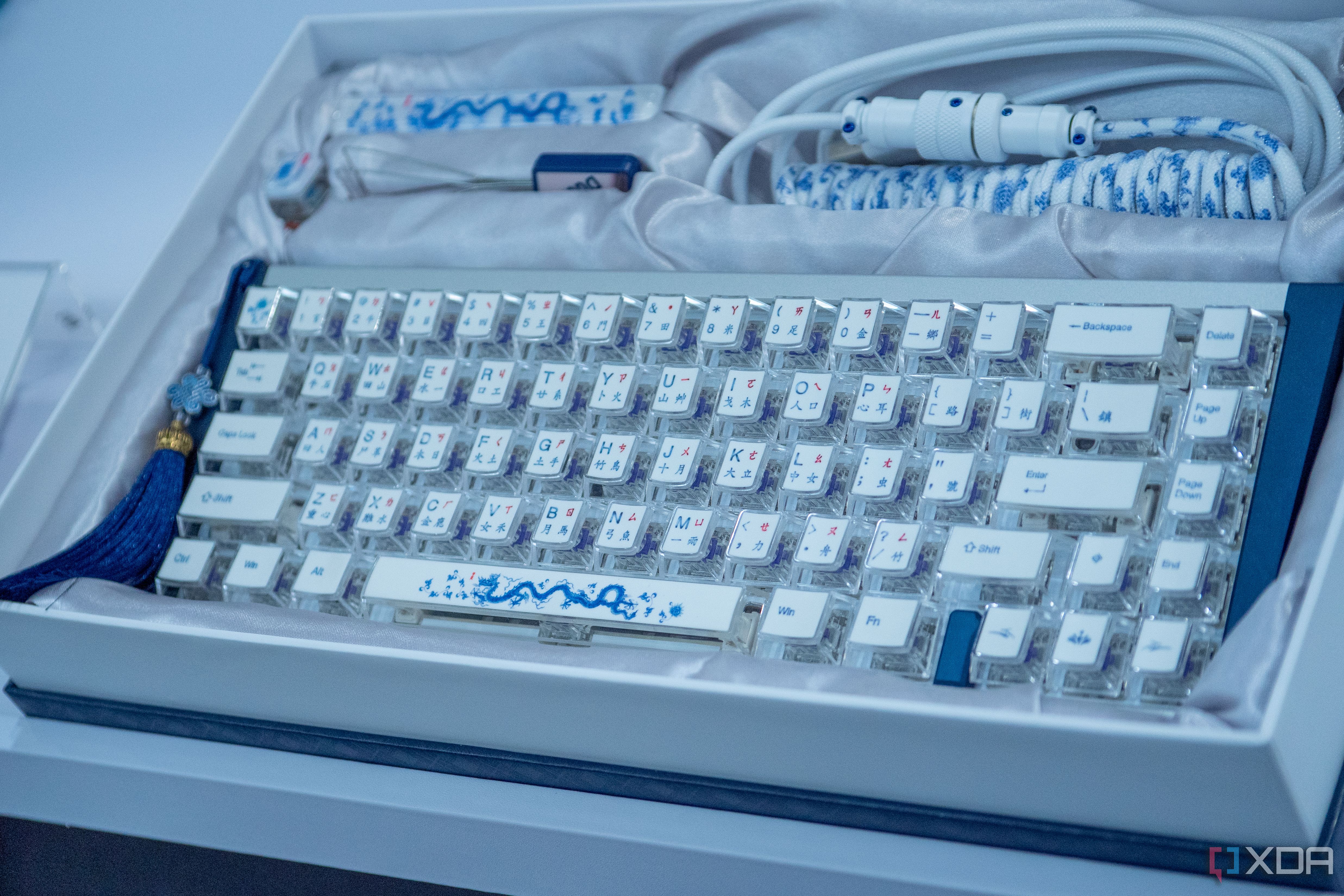 Ducky Year of the Dragon Keyboard showing artwork on keycaps and a tassle