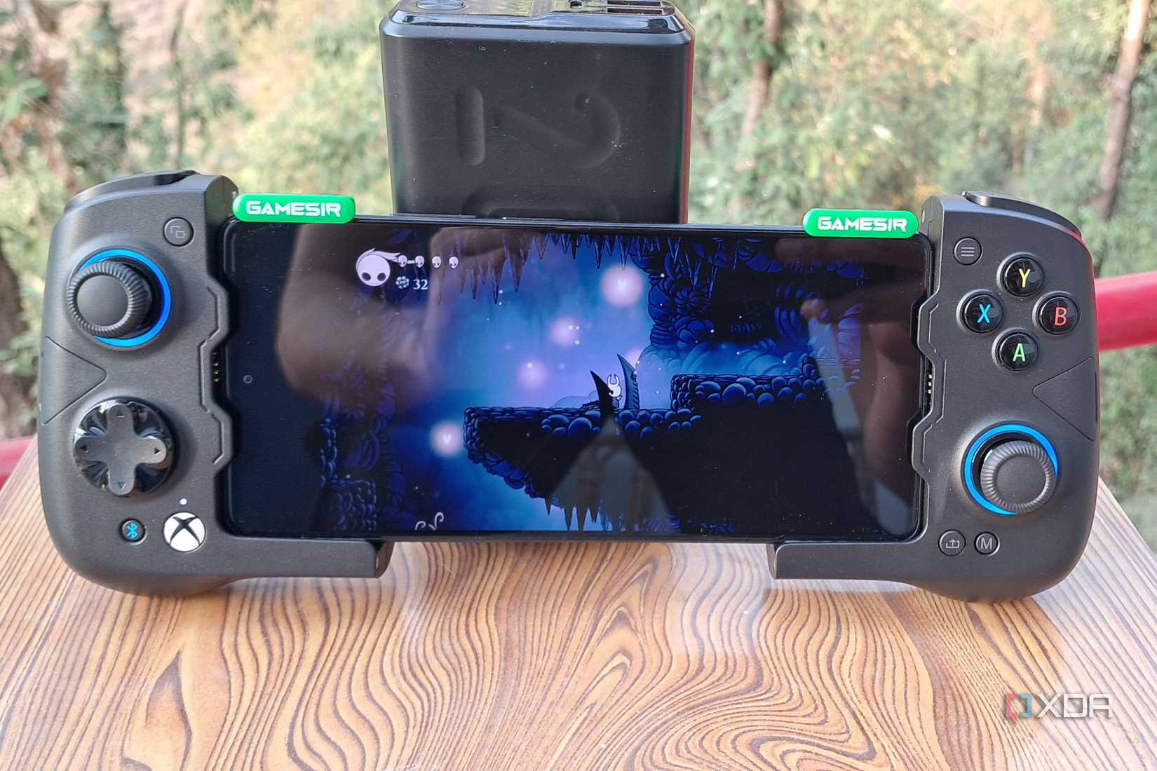 Hollow Knight running on a Poco F5 via Winlator, with the phone connected to a GameSir X4 Aileron controller