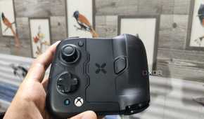 A person holding the GameSir X4 Aileron controller