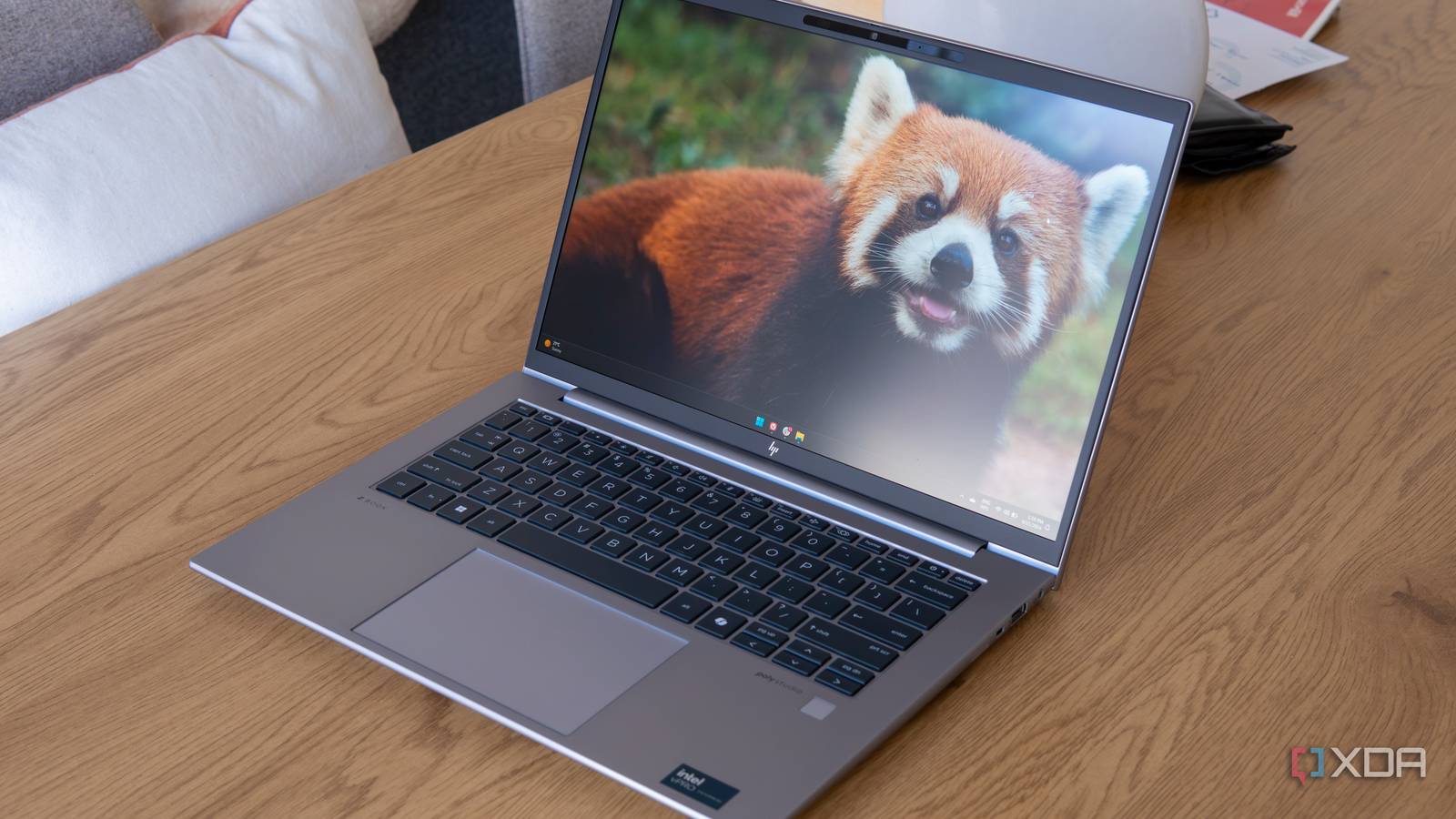 Angled view of the HP ZBook Firefly 14 G11 showing the Windows 11 desktop