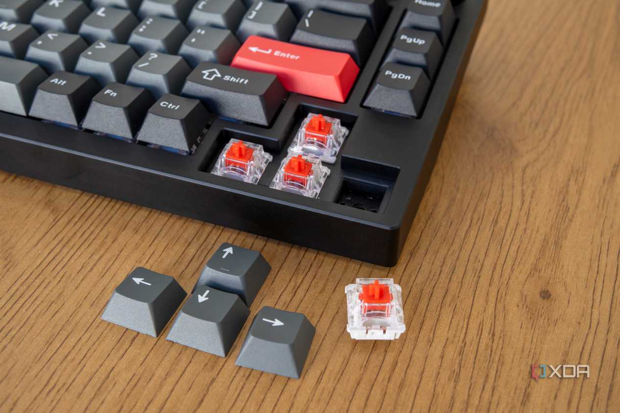 The arrow keys on the Lemokey P1 Pro with the keycaps and one of the switches removed