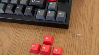 Close-up of the arrow keys next to replacement keycaps included with the Lemokey P1 Pro
