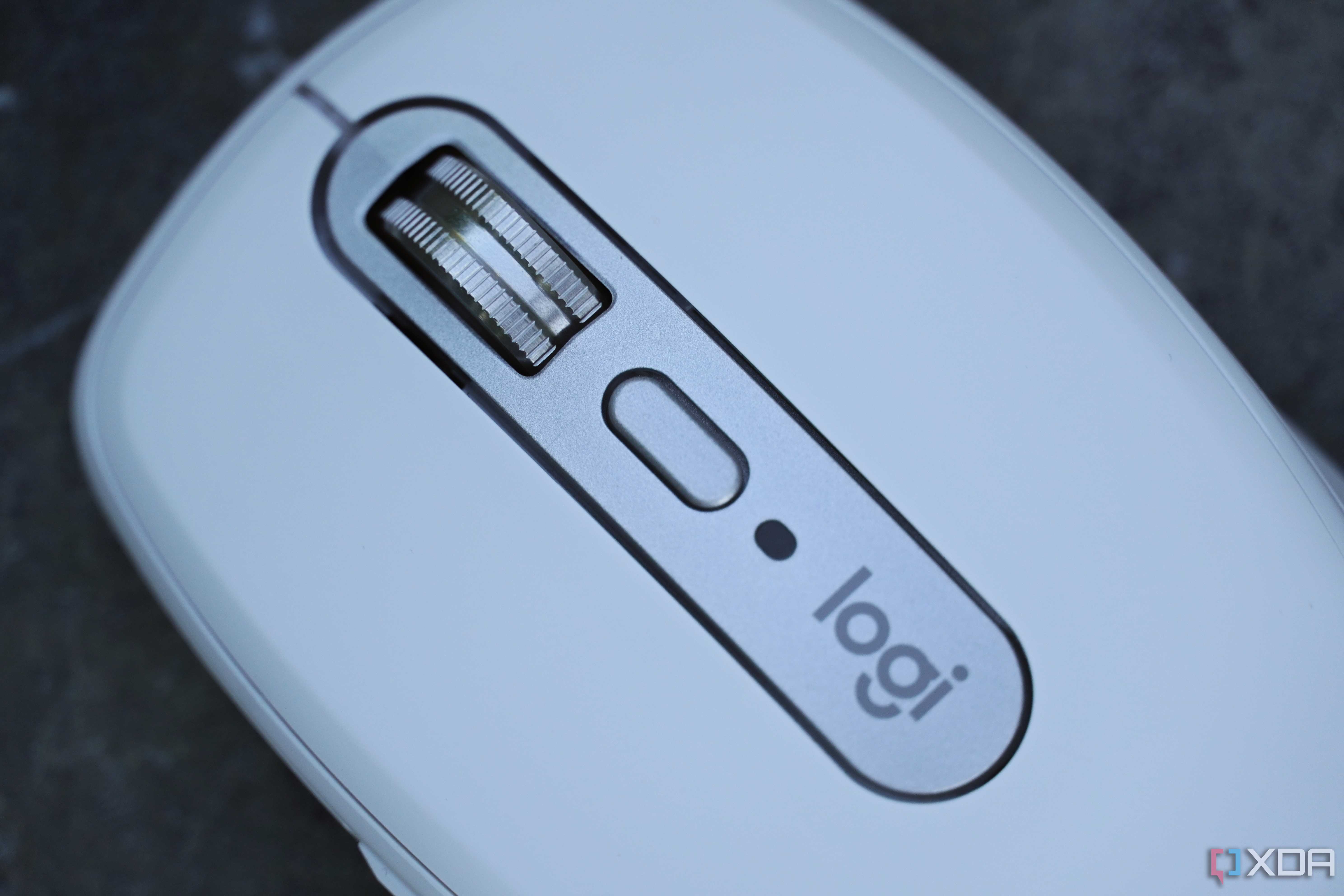 The scroll wheel and top button on the Logitech MX Anywhere 3S mouse.