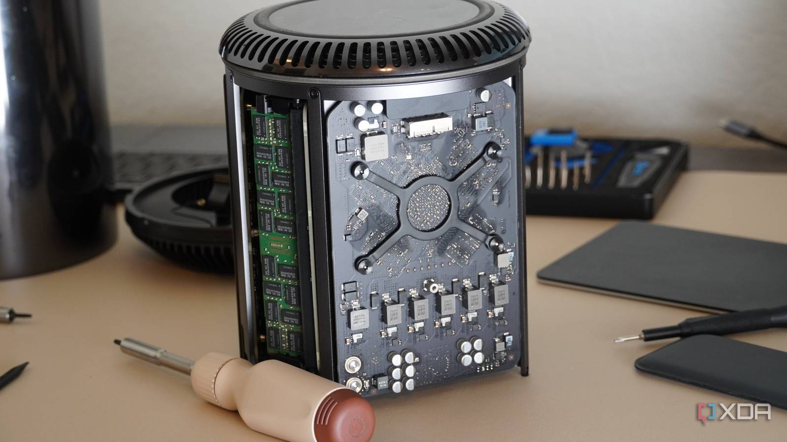 The Mac Pro (2013) halfway disassembled.