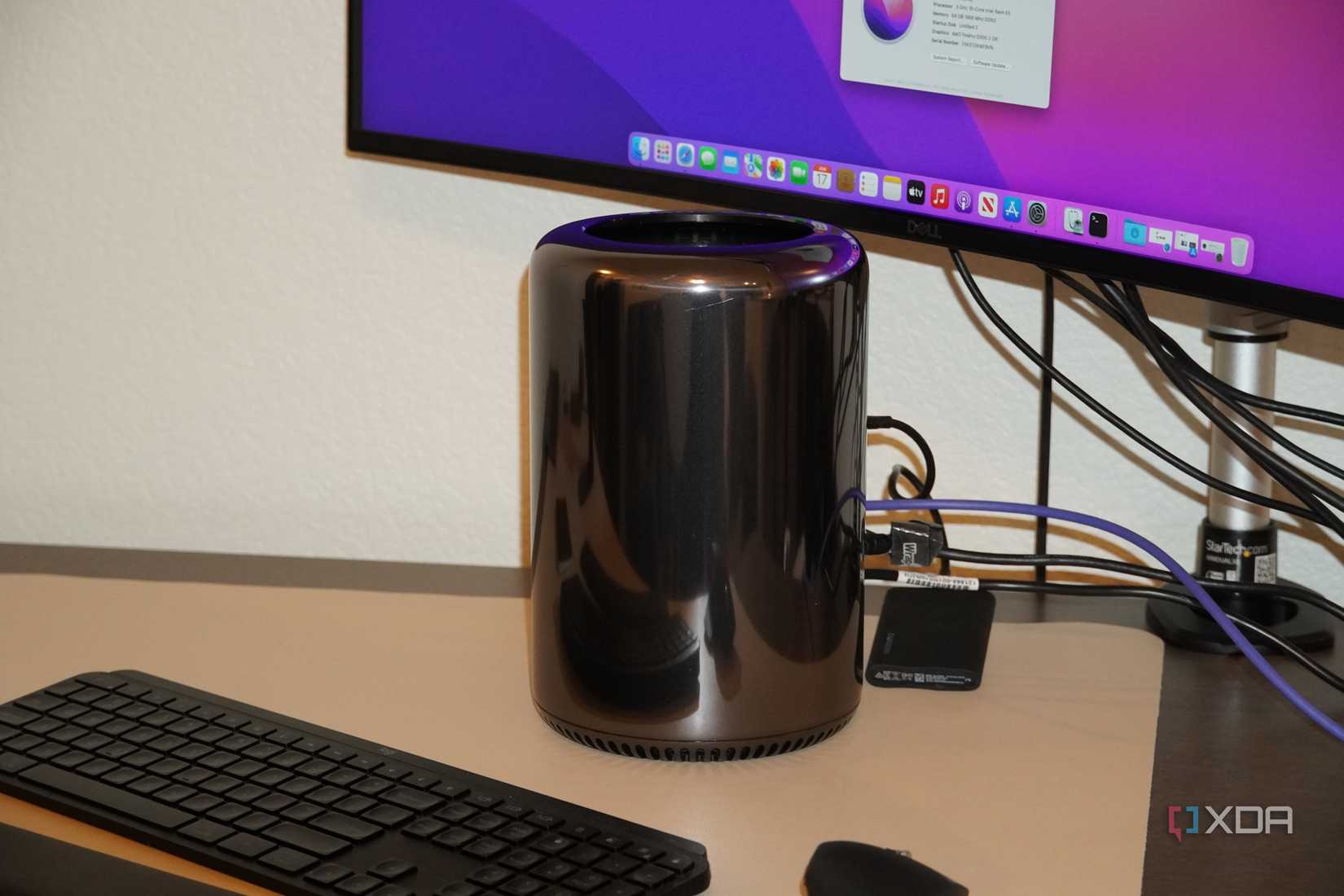 A "trash can" Mac Pro on a desk.