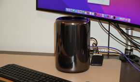 A "trash can" Mac Pro on a desk.