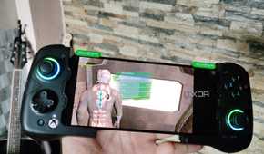 Dead Space running on a Poco F5 via Mobox, with a GameSir X4 Aileron controller connected to the phone