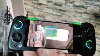 Dead Space running on a Poco F5 via Mobox, with a GameSir X4 Aileron controller connected to the phone