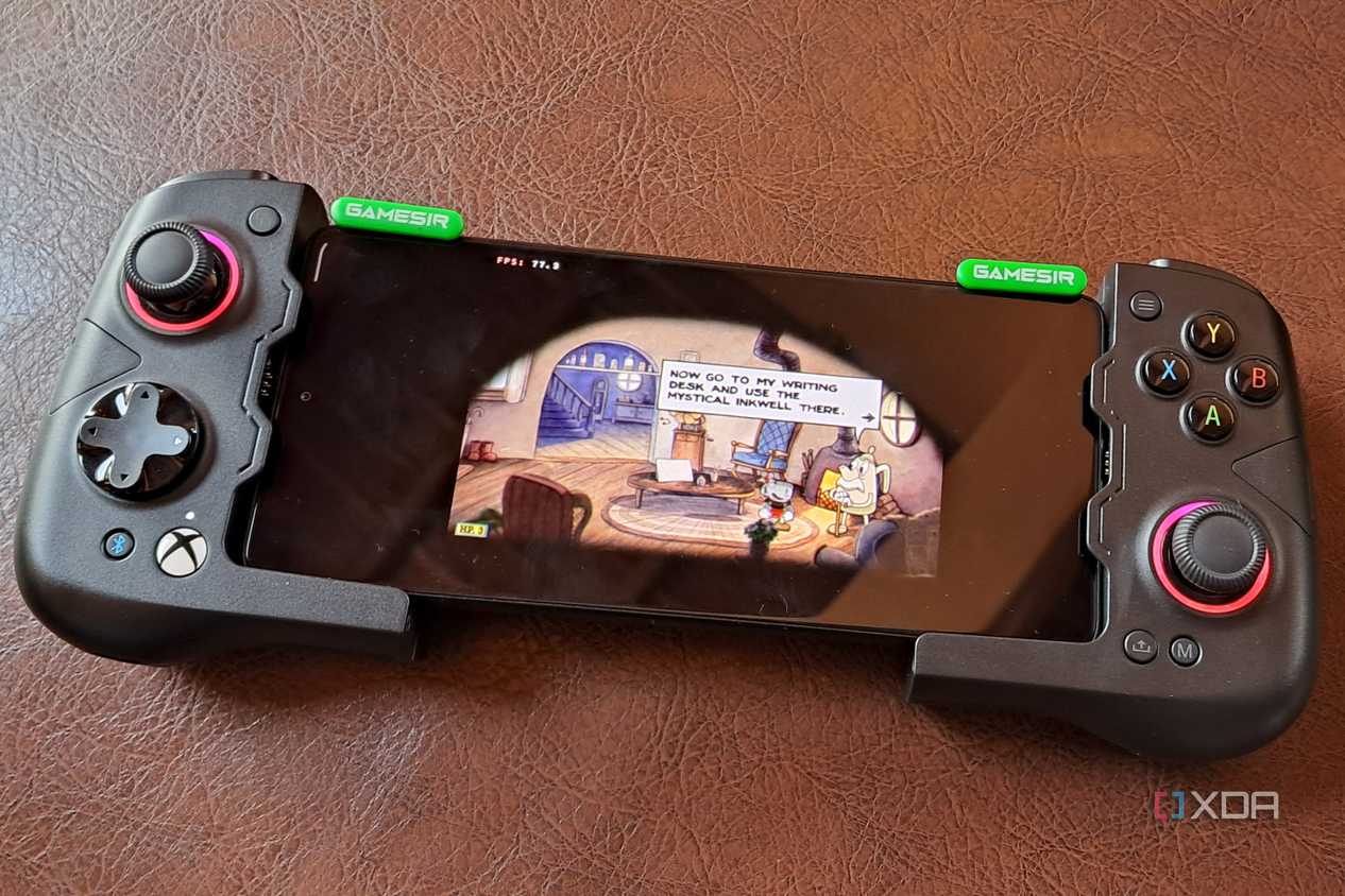 A GameSir X4 Aileron controller connected to a Poco F5, with the phone running Cuphead via Winlator