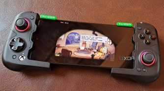 A GameSir X4 Aileron controller connected to a Poco F5, with the phone running Cuphead via Winlator
