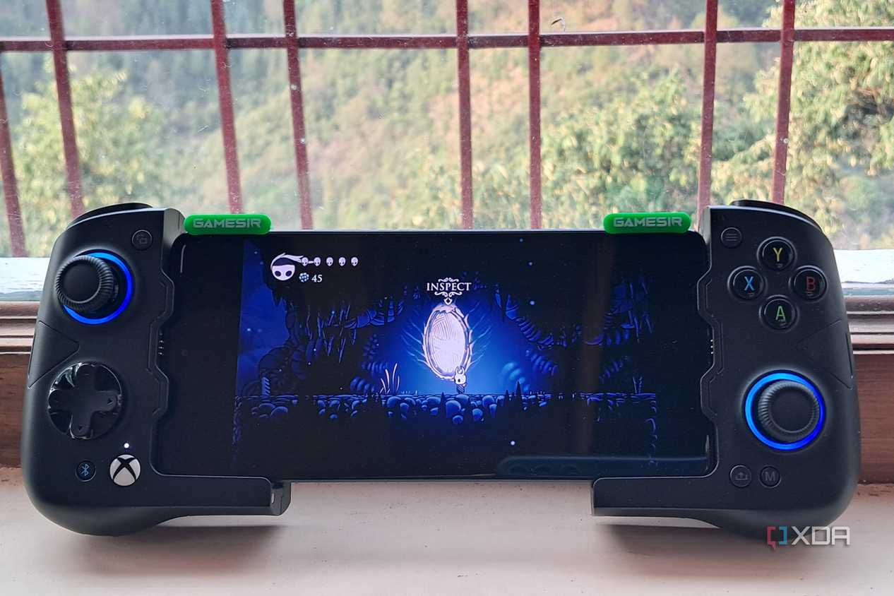 A GameSir X4 Aileron controller connected to a Poco F5, with the phone running Hollow Knight via Winlator