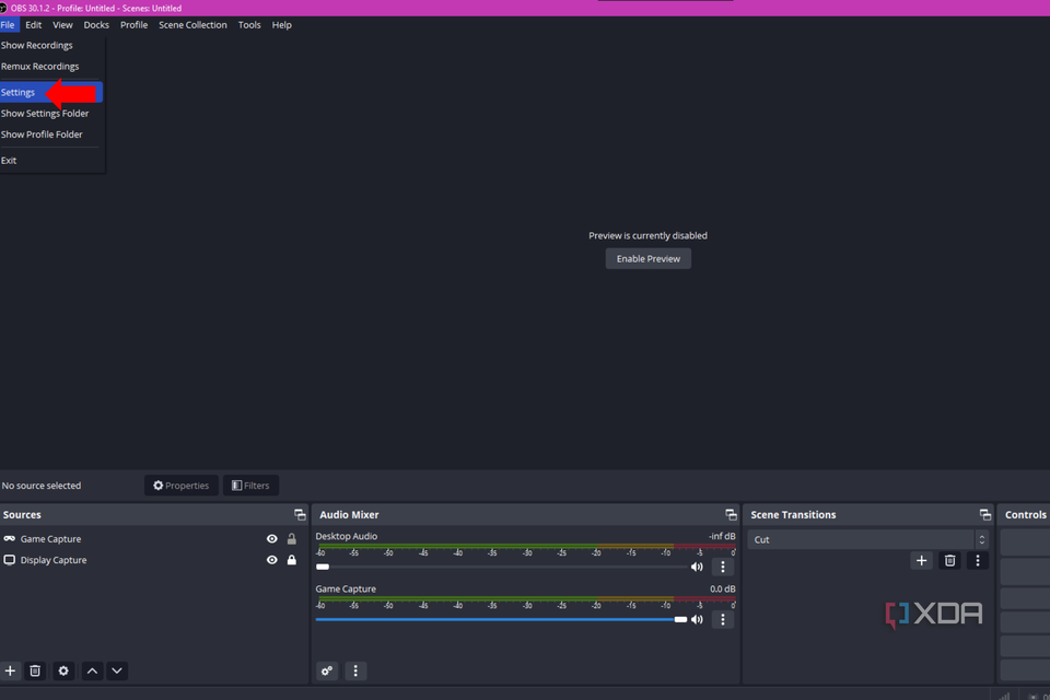 An arrow pointing to the settings option in OBS Studio