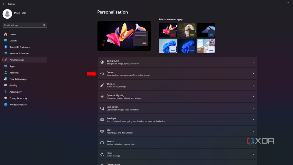 An arrow pointing to the Colors settings in the Personalization tab on Windows 11