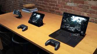 An iPhone, iPad, and MacBook playing the same game on a table.