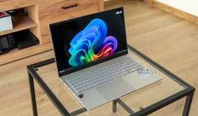 Angled view of the Asus Vivobook S 15 on a glass table