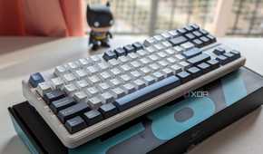 A white-themed keyboard placed on its box