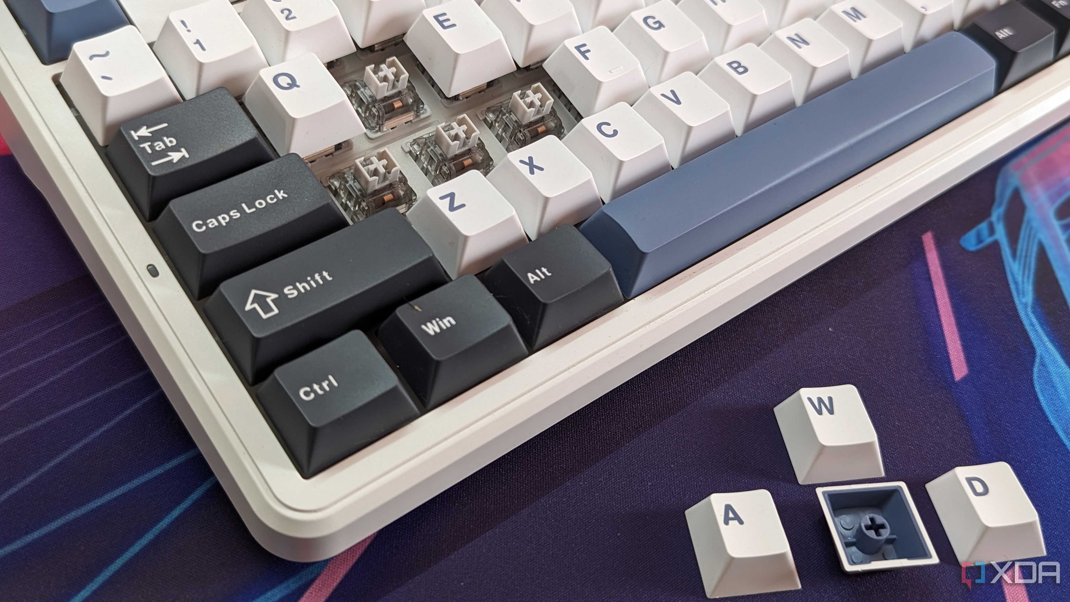 Close-up of a mechanical keyboard showing the switches with the keycaps removed
