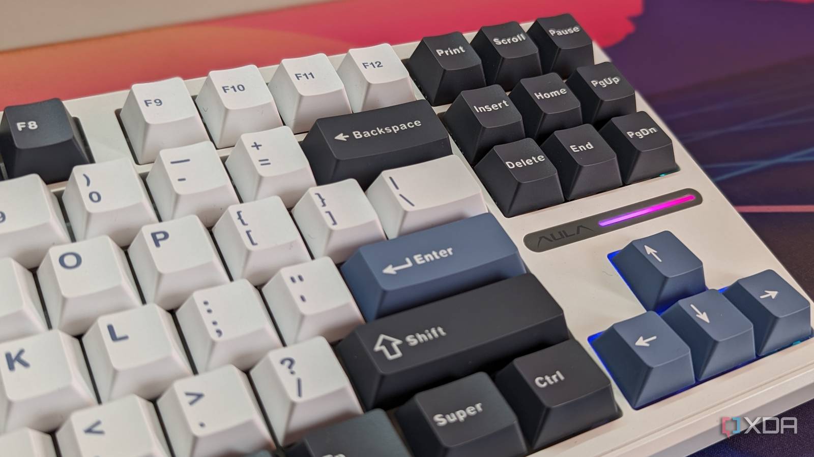 Close-up of a mechanical keyboard showing keycaps and RGB lighting