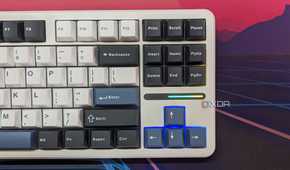 A keyboard shown from the top with RGB lighting on the arrow keys