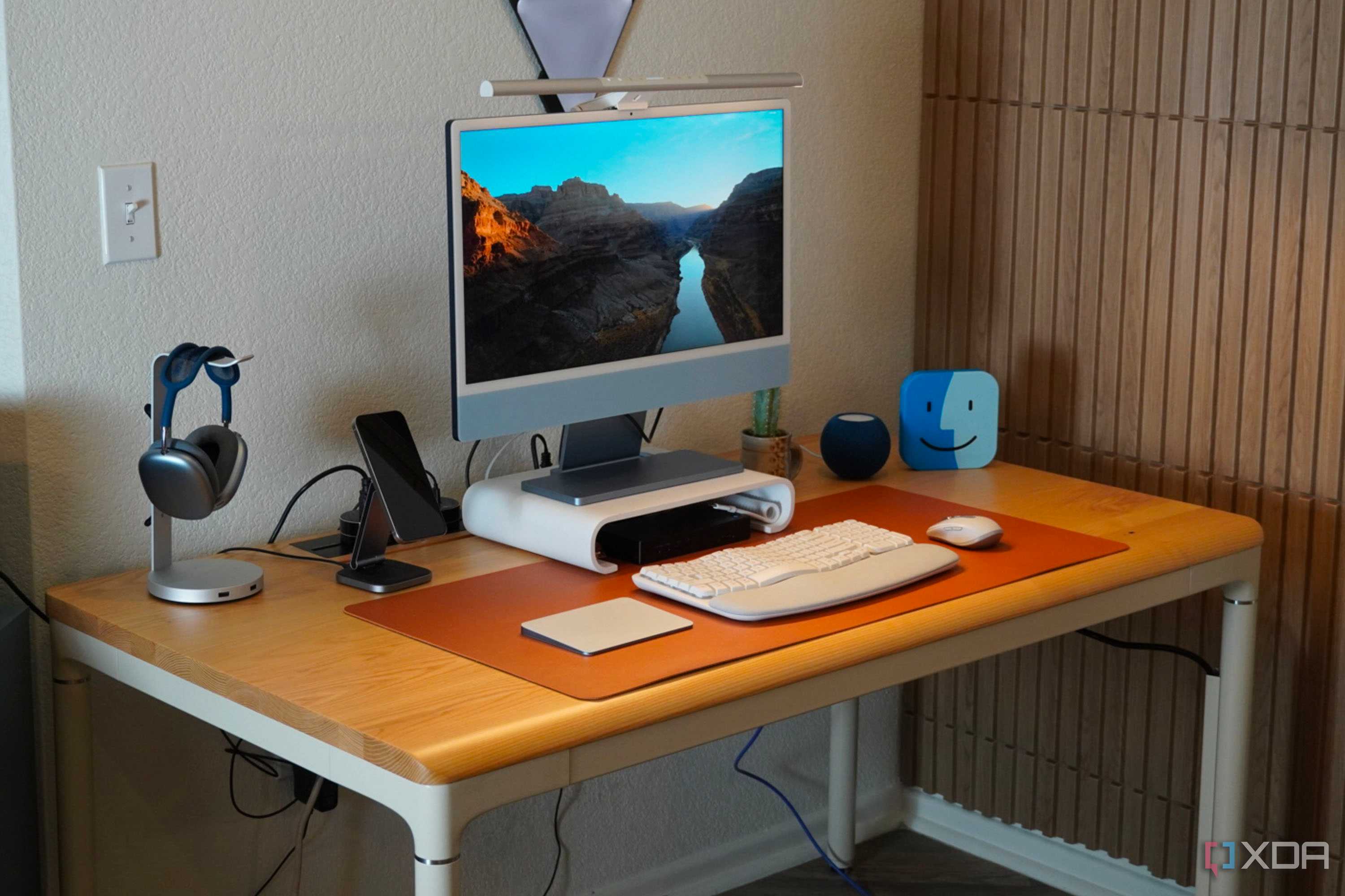 The Autonomos SmartDesk Levitate at the center of a desk setup.