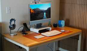 The Autonomos SmartDesk Levitate at the center of a desk setup.