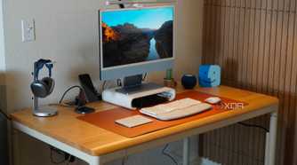 The Autonomos SmartDesk Levitate at the center of a desk setup.