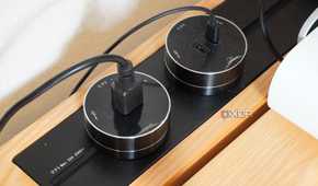 Plugs on the power track system on the SmartDesk Levitate.
