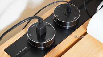 Plugs on the power track system on the SmartDesk Levitate.