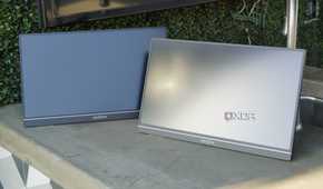 Two Arzopa portable monitors on a concrete countertop.