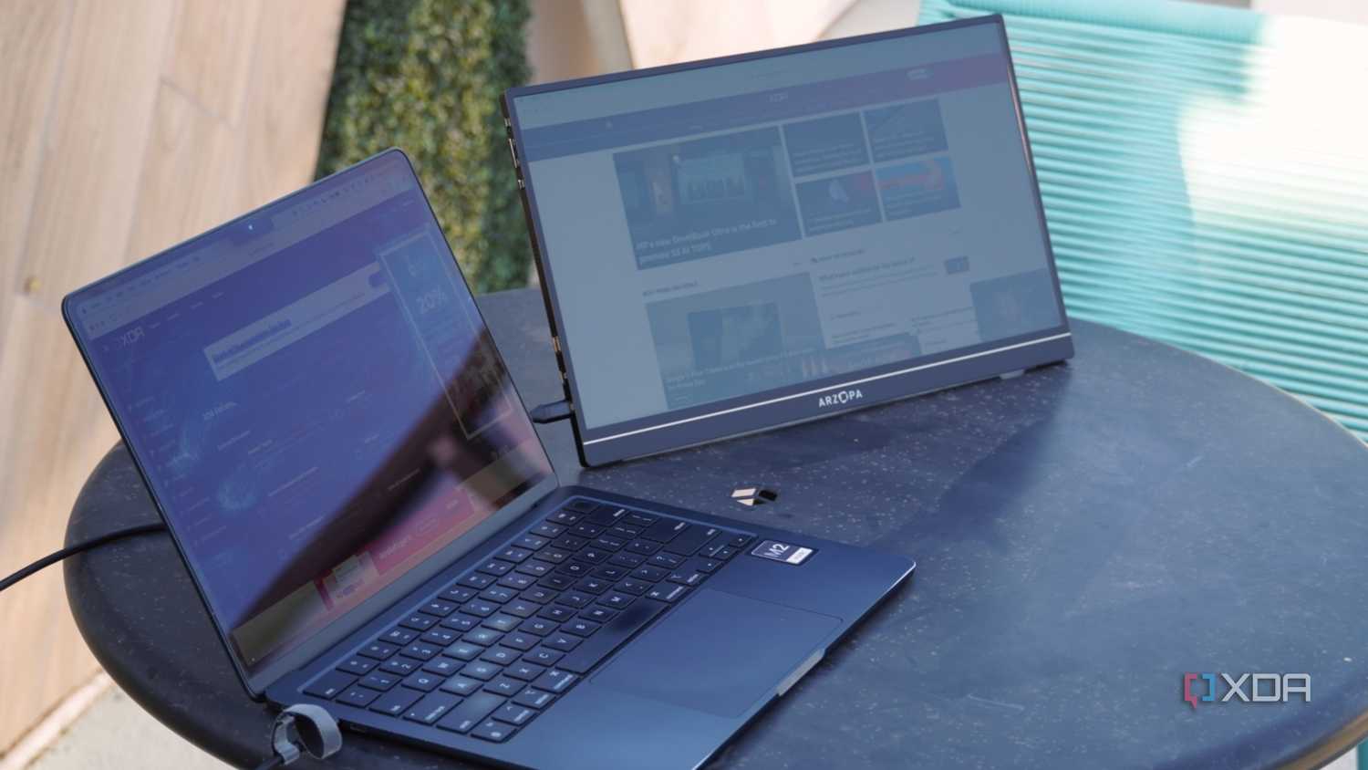 An angled view of the Arzopa portable monitor connected to a MacBook.