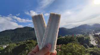 A person holding two breadboards