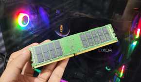 A person holding a 32GB ECC DDR4 RAM stick