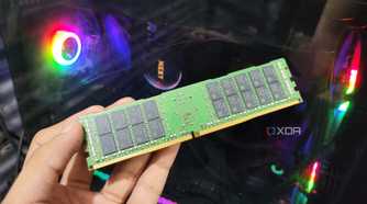 A person holding a 32GB ECC DDR4 RAM stick