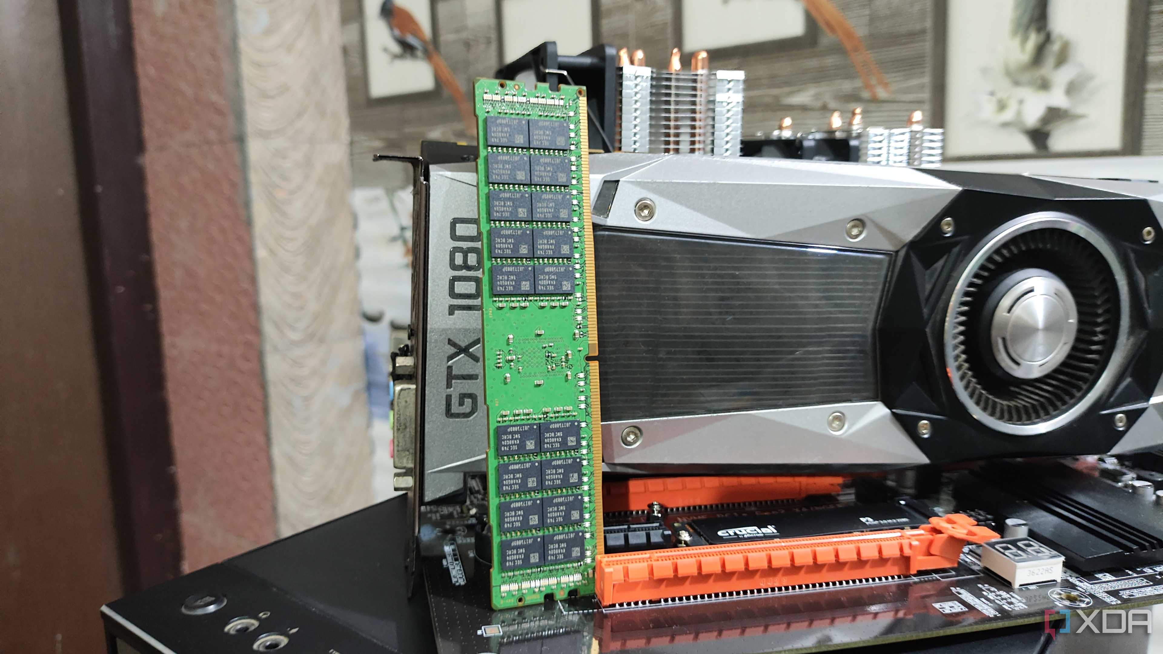 A 32GB ECC DDR4 RAM stick resting against a GTX 1080