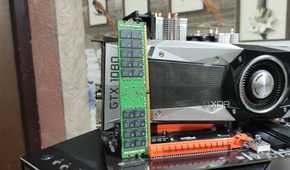 A 32GB ECC DDR4 RAM stick resting against a GTX 1080