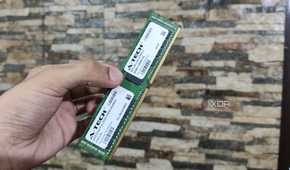 A person holding a 32GB ECC DDR4 RAM stick