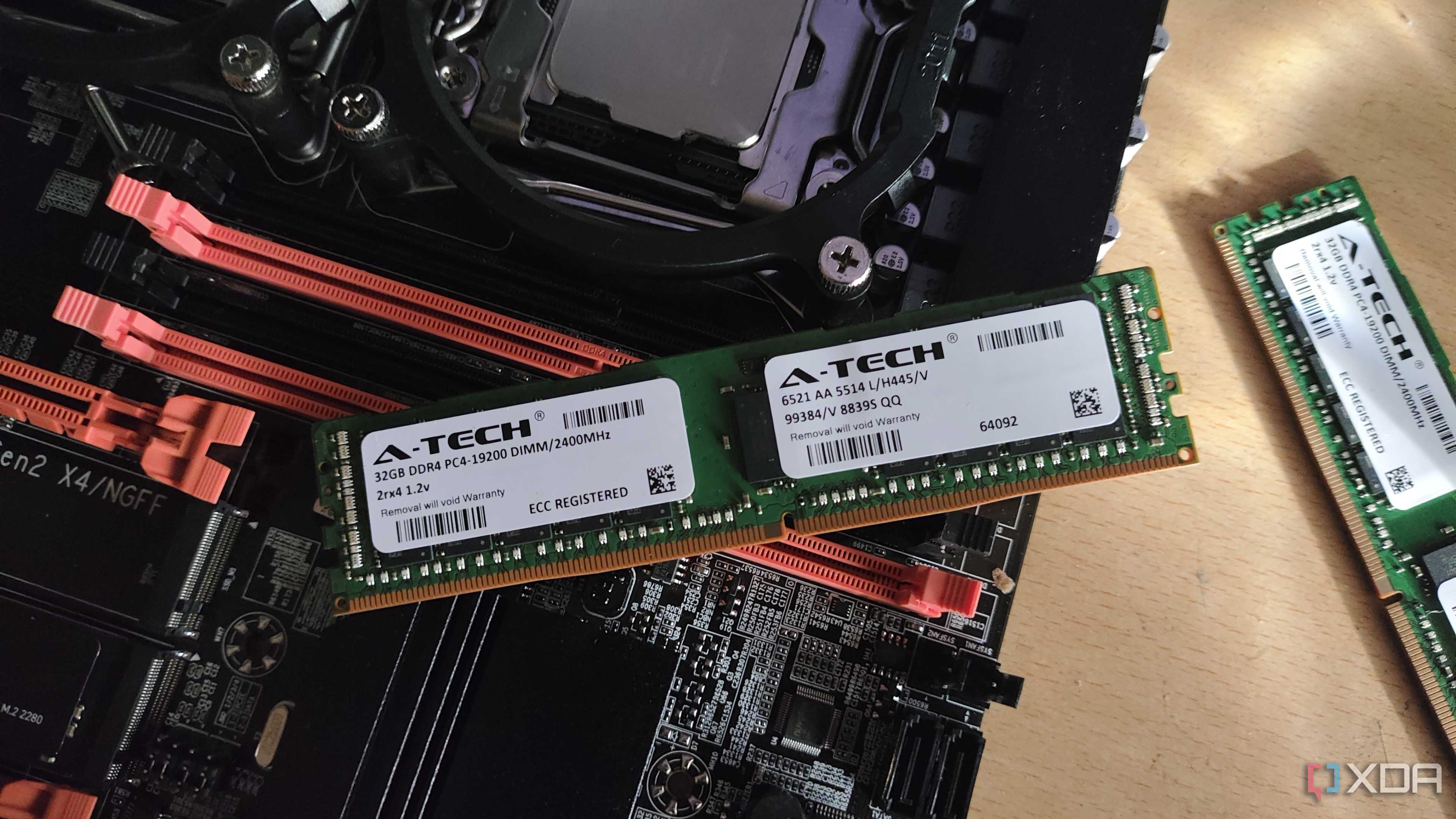 A 32GB ECC RAM stick resting on an X99 server motherboard