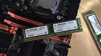 A 32GB ECC RAM stick resting on an X99 server motherboard