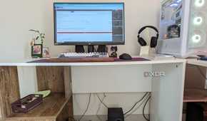 Gaming PC setup showing a mess of cables under the desk